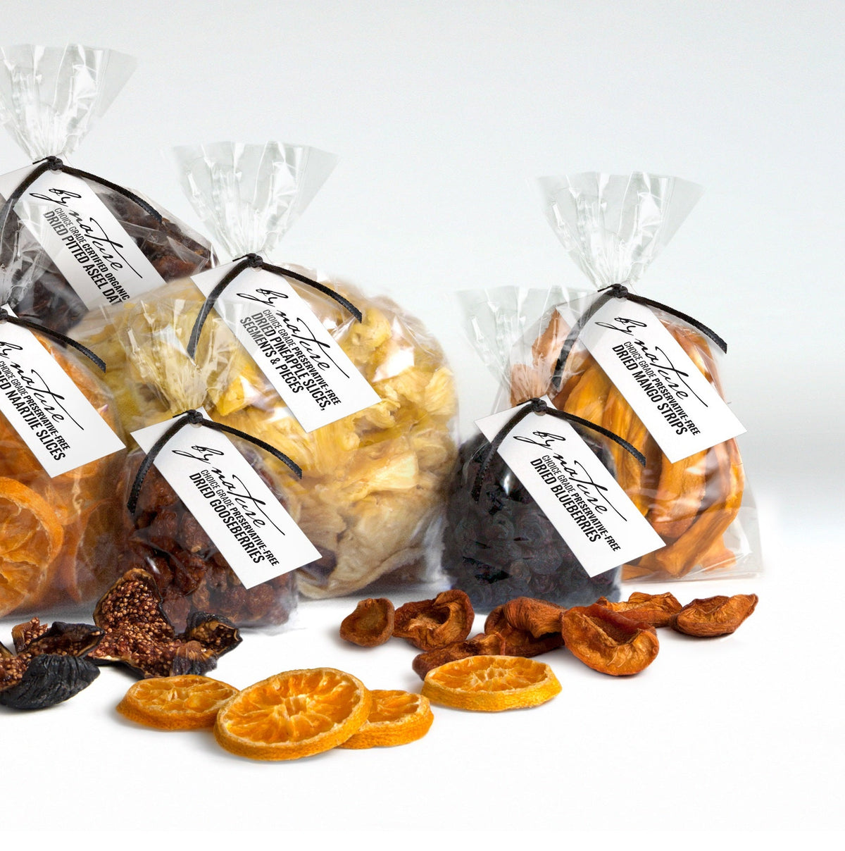 Packaged dried fruits with visible brand name on a white background