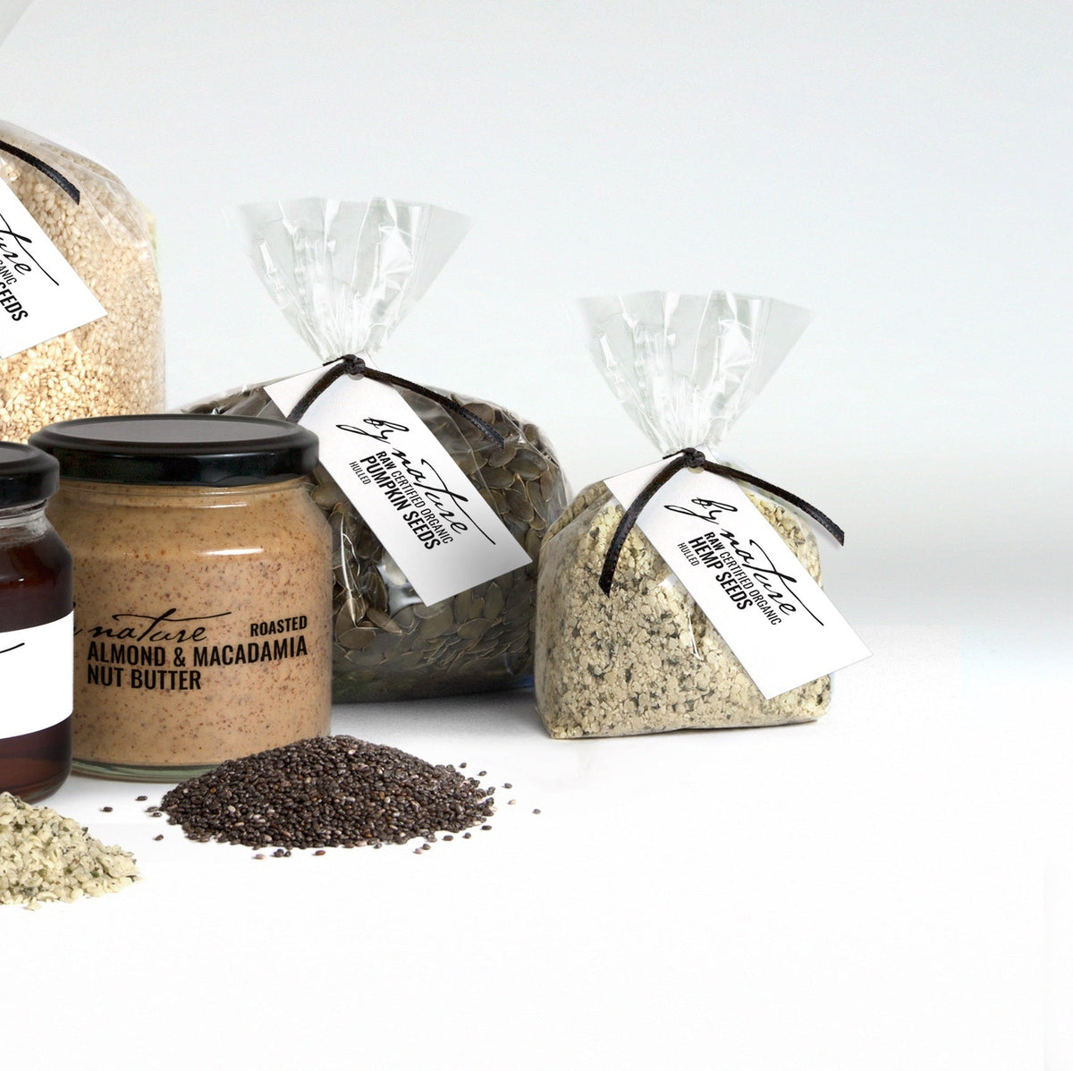 Assorted food products including jars and bags on a white background
