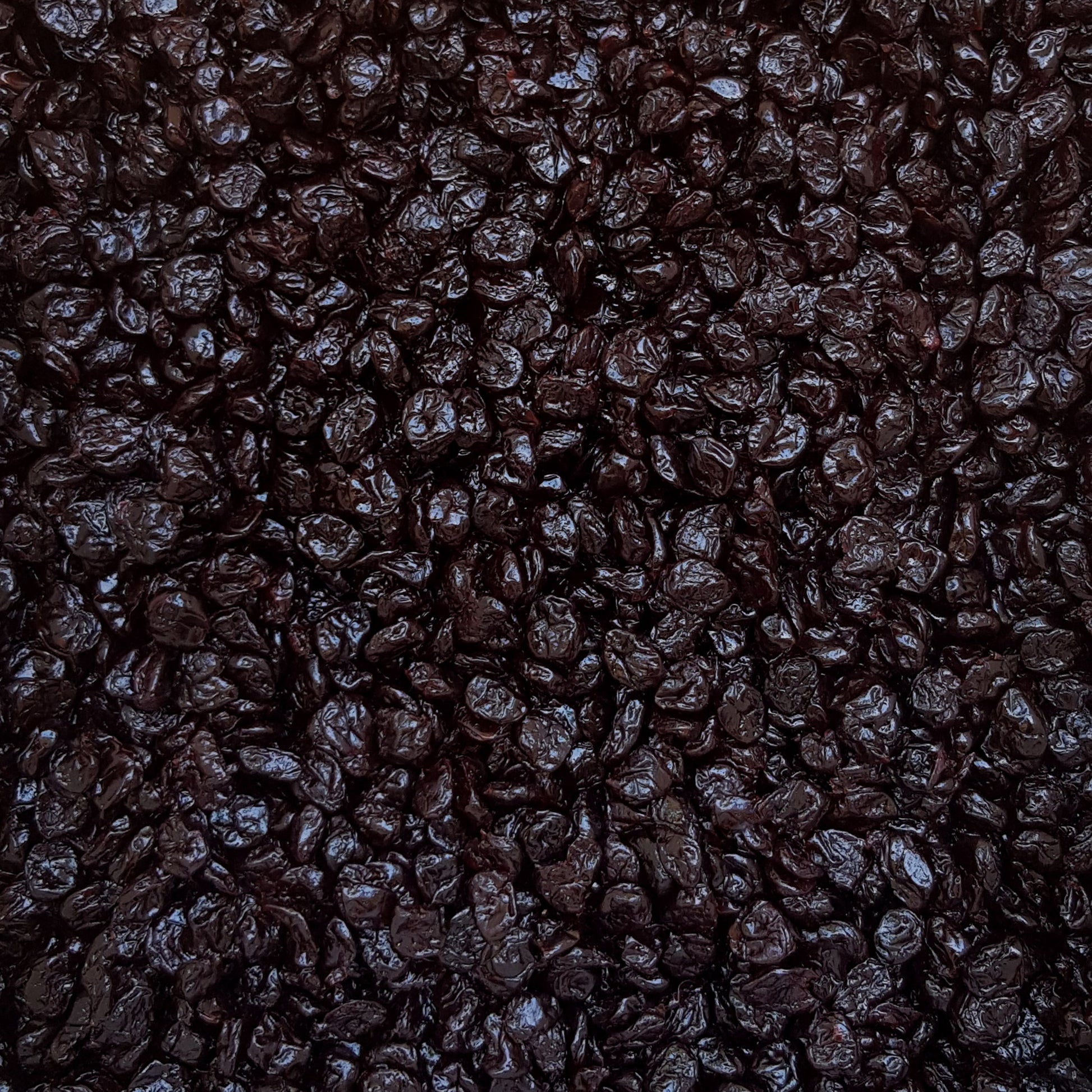 Full frame overhead image of BY NATURE Dried Sour Cherries - apple juice infused, preservative-free.