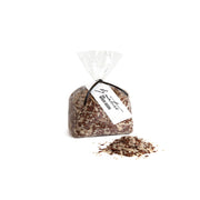 Bag of mixed seeds with a visible brand label on a white background