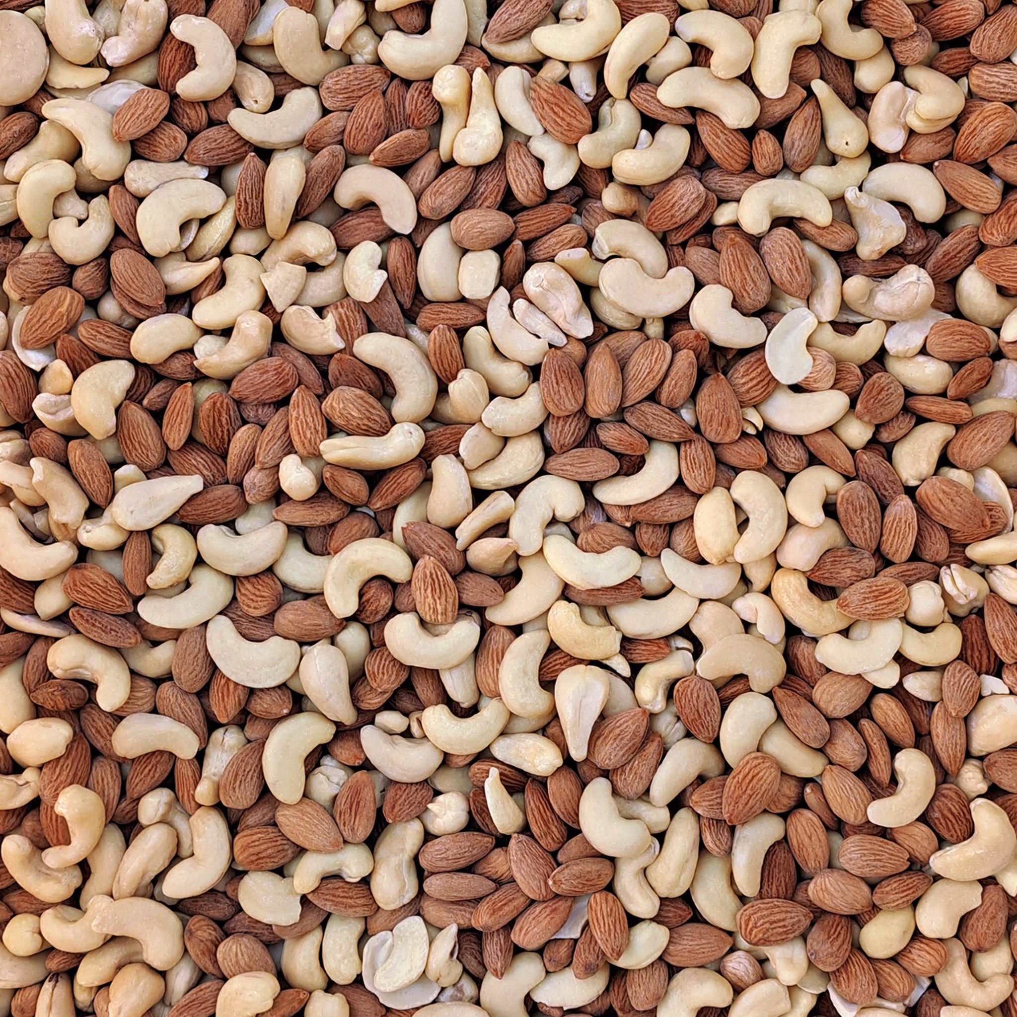 Full frame overhead image of BY NATURE Mixed Nuts - almonds, cashew nuts, salted.