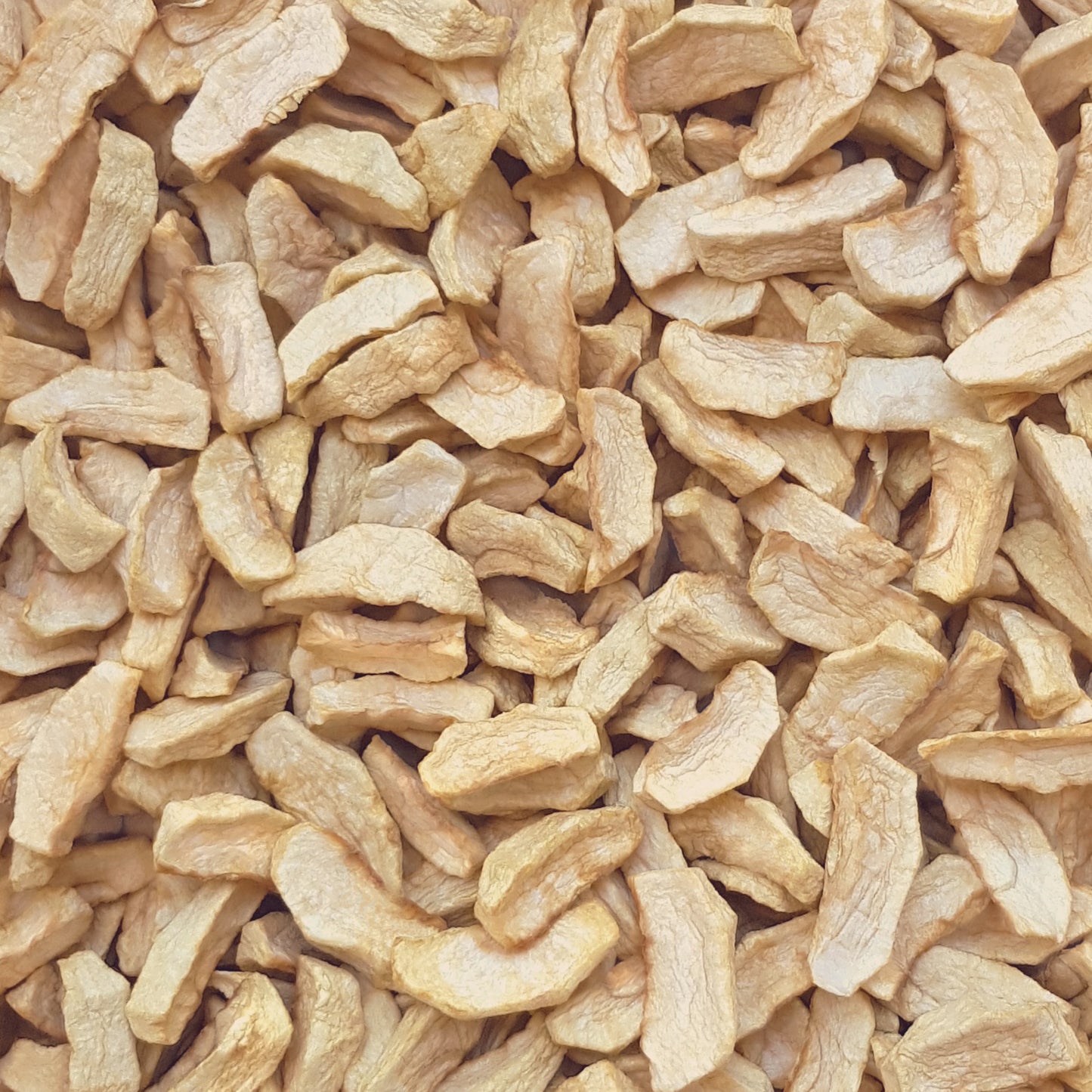 Full frame overhead image of BY NATURE Dried Apple Segments - preservative-free.