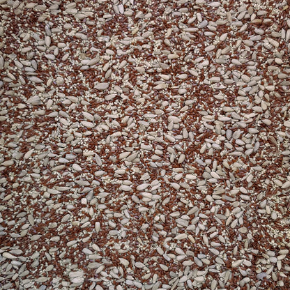 Full frame overhead image of BY NATURE Mixed Seeds - flax, sesame, sunflower, raw, certified organic at source.