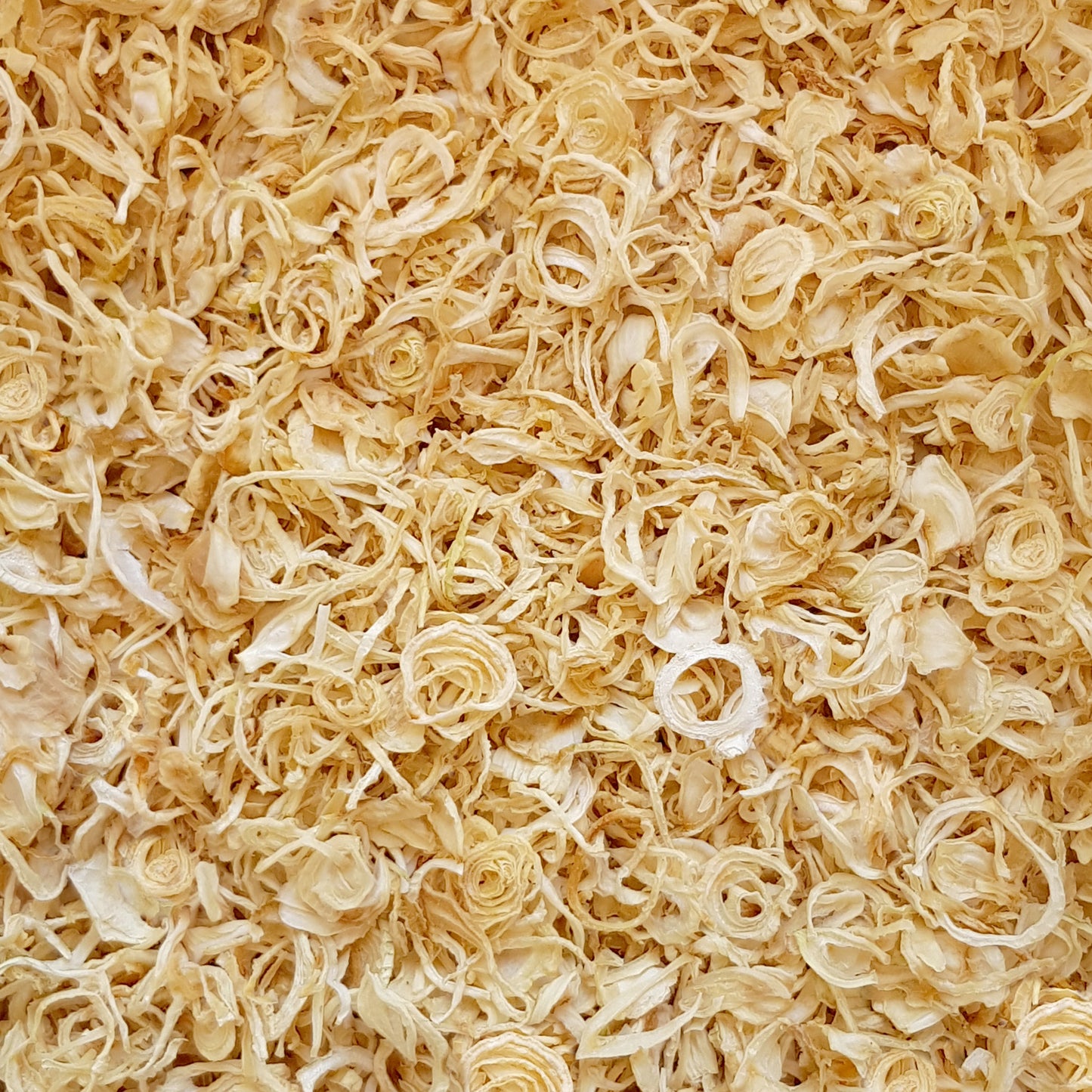 Full frame overhead image of BY NATURE Dried Onion Rings - preservative-free.