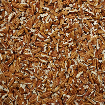 Full frame overhead image of BY NATURE Pecan Pieces - raw, certified organic at source.
