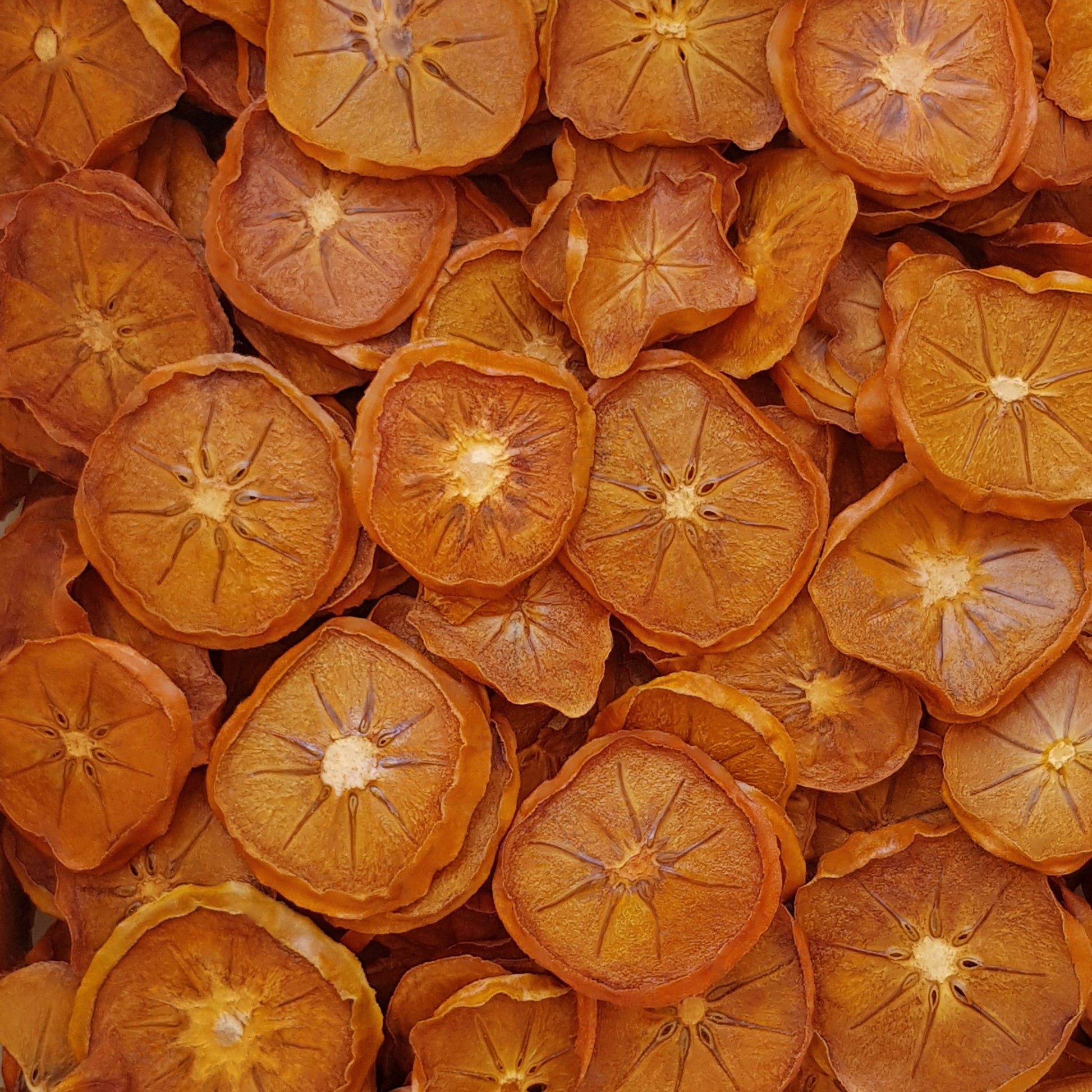 Full frame overhead image of BY NATURE Dried Persimmon Rings - preservative-free.