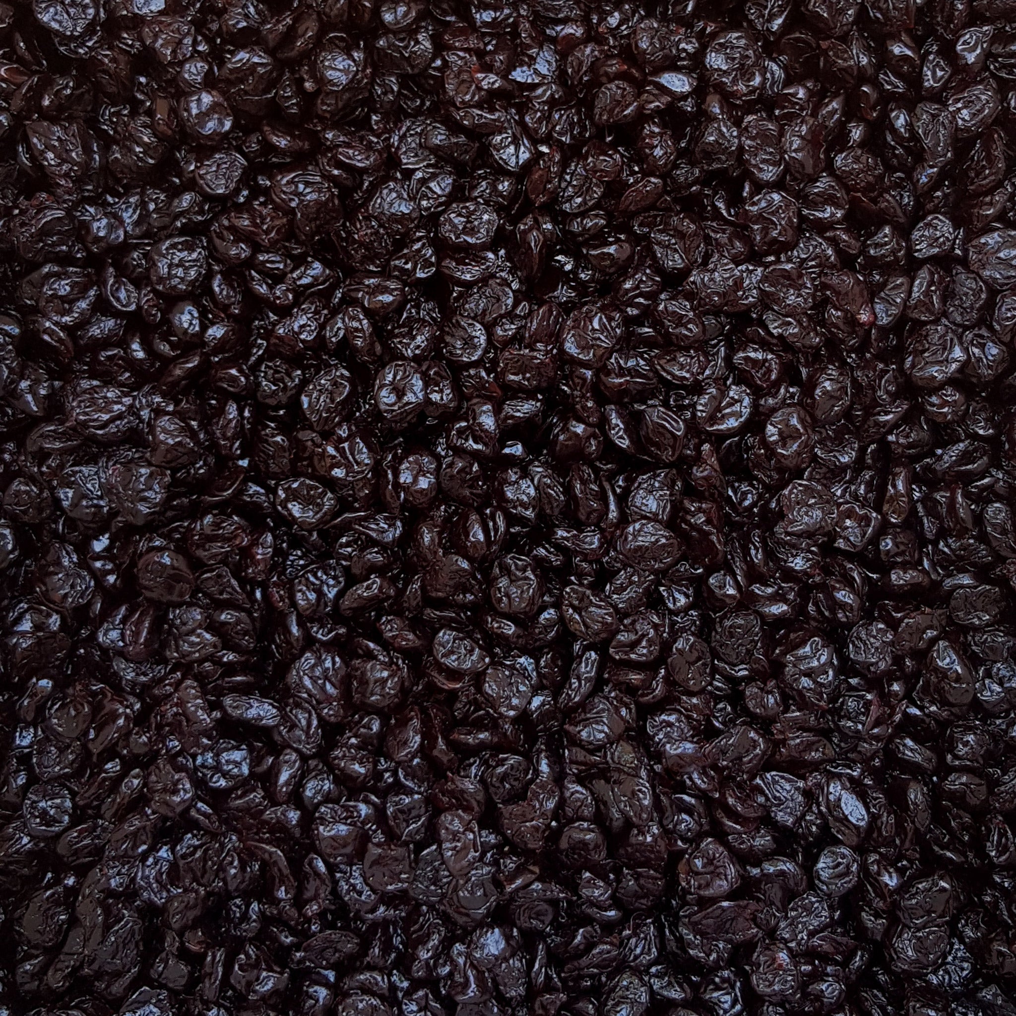 Full frame overhead image of BY NATURE Dried Sour Cherries - apple juice infused, preservative-free.