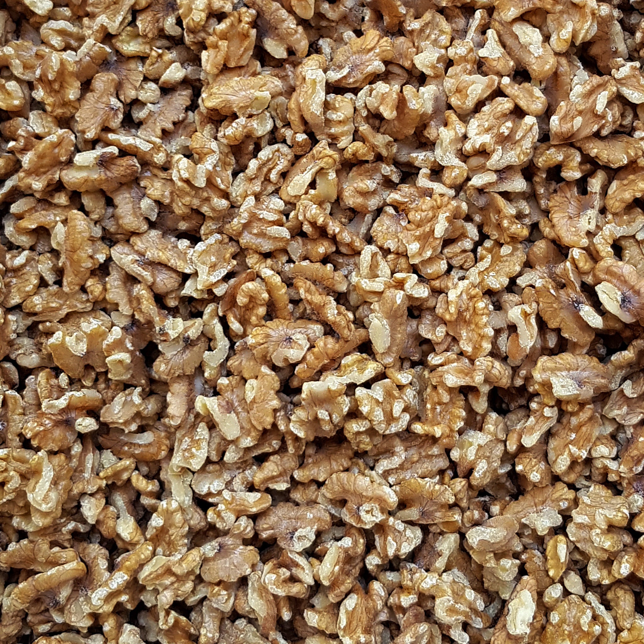 Full frame overhead image of BY NATURE Walnut Pieces - raw.